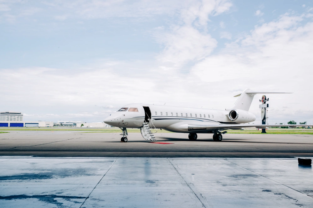 side view of a private jet at an airport