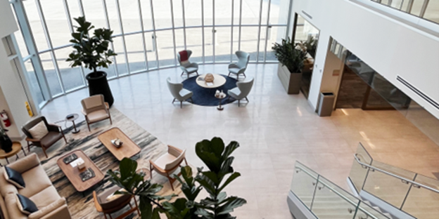 Luxury private terminal lounge with comfortable seating and tarmac views