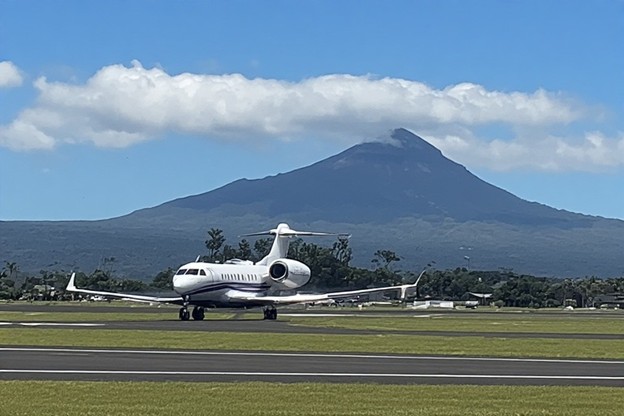 Private jet landing on a Hawaiian airport runway