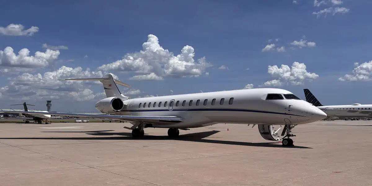 A large private jet parked on the runway.
